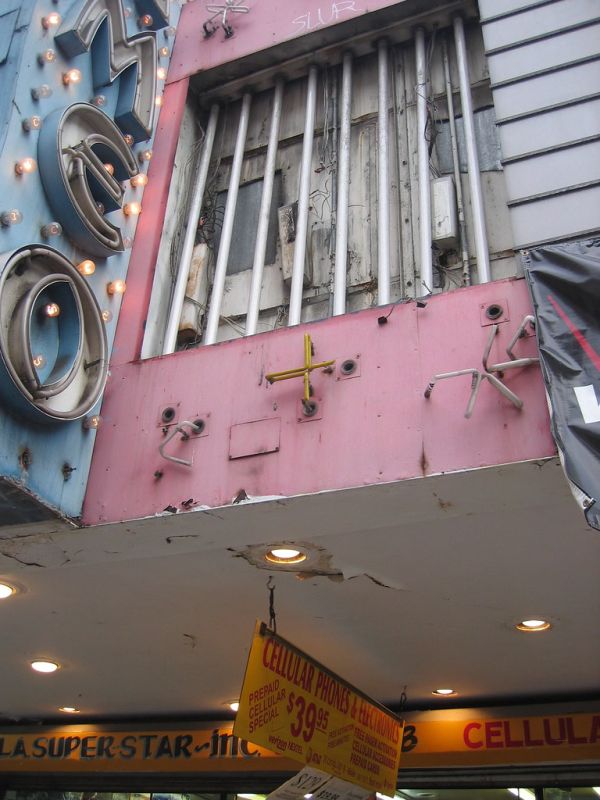 Illuminated cinema marquee at night