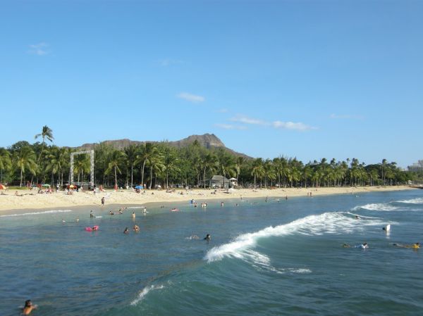 Surfers preparing to enter the water at a Korean beach