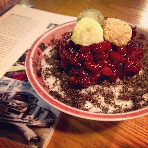 Sweet Korean rice cakes coated in bean powder on a plate