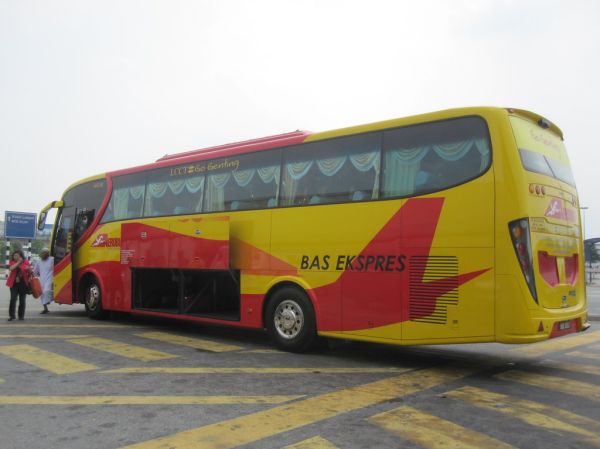 Airport limousine bus parked outside terminal building