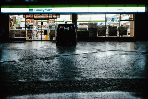Illuminated convenience store storefront at night