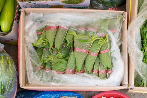 Fresh vegetables and greens for sale at a Korean traditional market