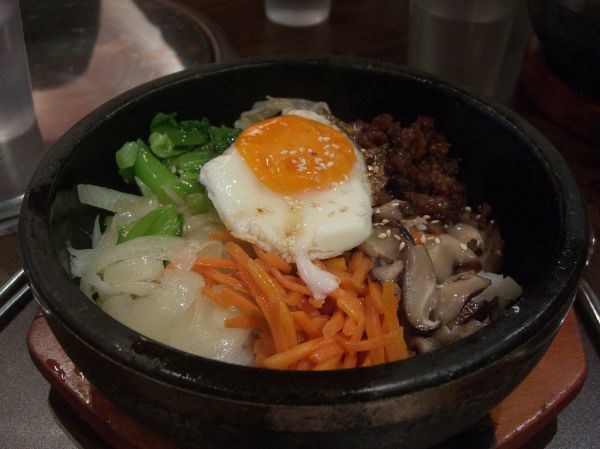 Bowl of Korean bibimbap with mixed vegetables and rice