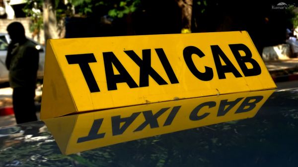 Taxi waiting at a curb outside a terminal