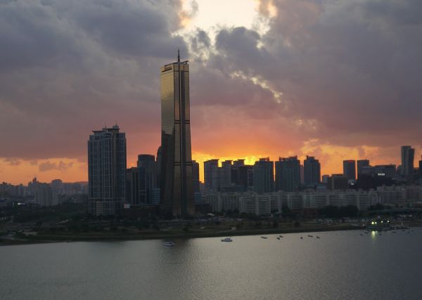 Seoul city skyline at dusk with illuminated skyscrapers
